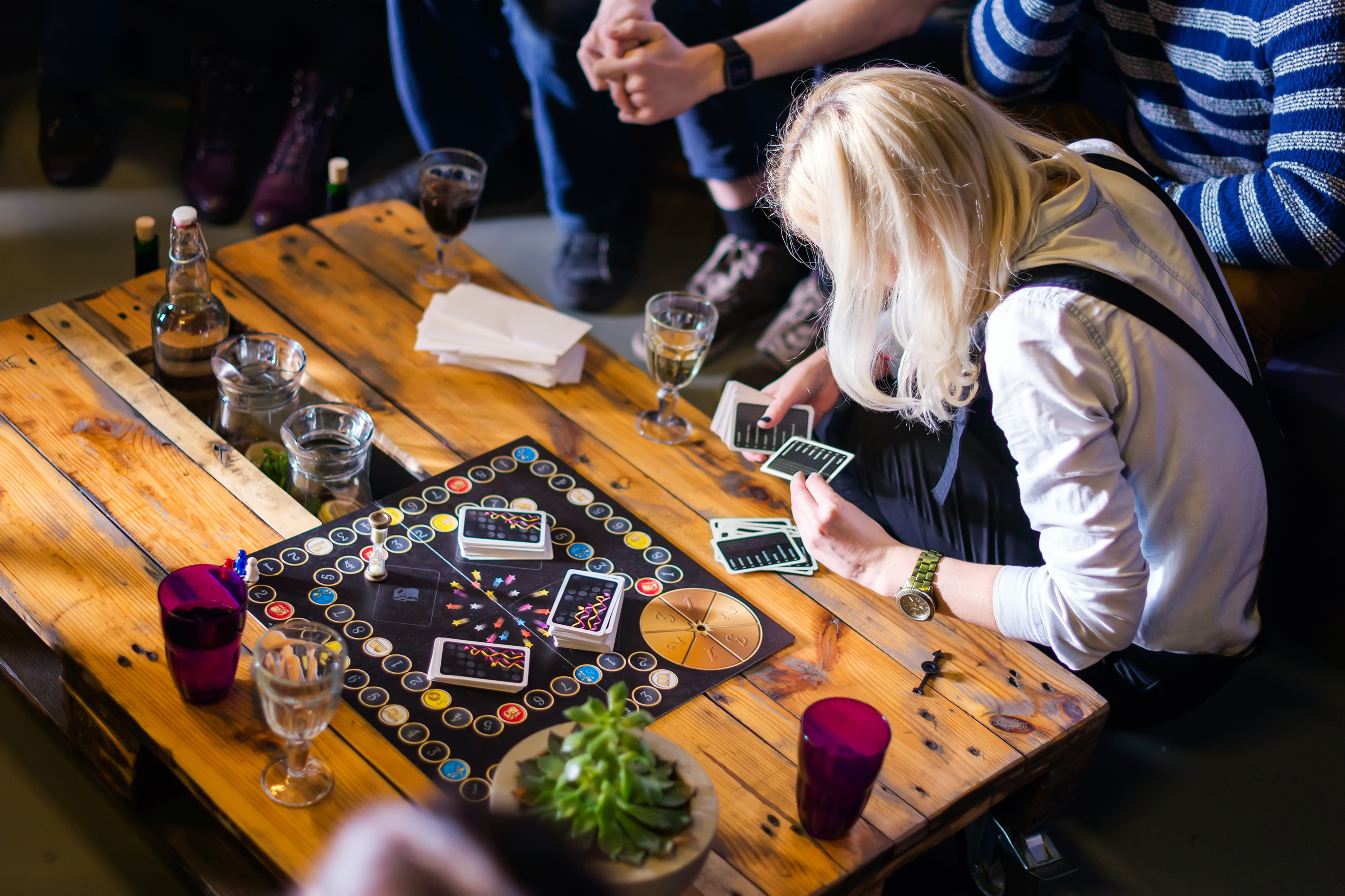 People gathered around a table playing board games